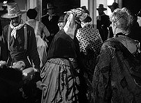 Fig. 2: Lucy calls out to Dallas from the  stretcher at the left edge of the frame.
