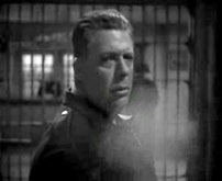 Fig. 3. Marlowe smokes as he is questioned by the police.