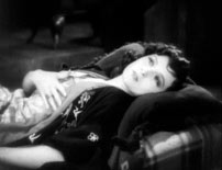 Fig. 13. The River (1929). Rosalee (Mary Duncan) rubs her hand across her breasts while speaking of the beating of her heart.