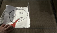 Fig.11: En blodig tegning som George modtager.