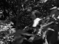 Fig. 6-7. Tracking shots follow the woodcutter striding into the forest in Rashomon.